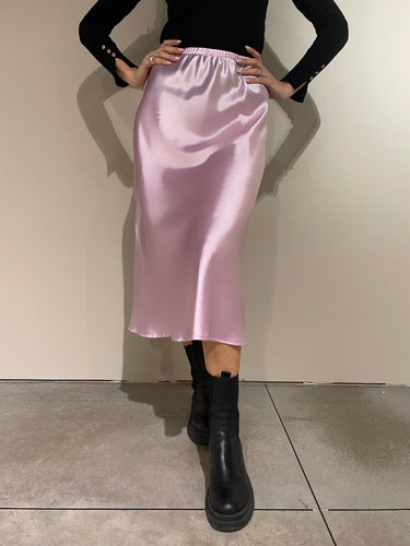 Gonna midi in rasetto satinato color lilla, con elastico in vita.  Composizione: 100% poliestere.